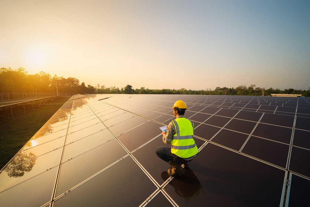 man with solar power tiles